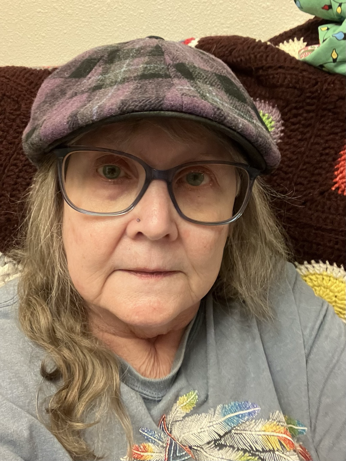 Me wearing my purple plaid flat hat.